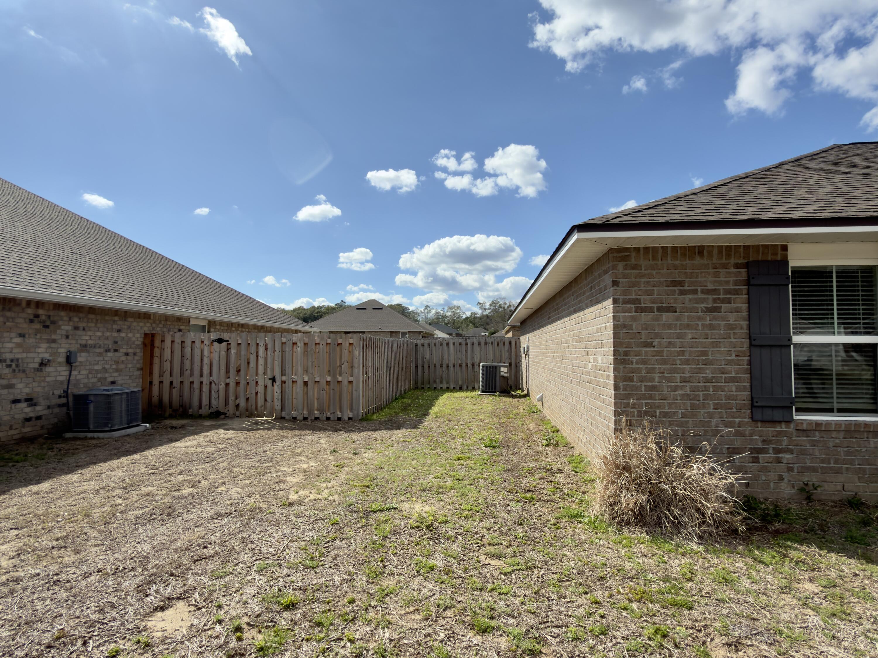 5281 Moore Loop Crestview, FL 32536 - Photo 26 of 28 a view of a house with a yard