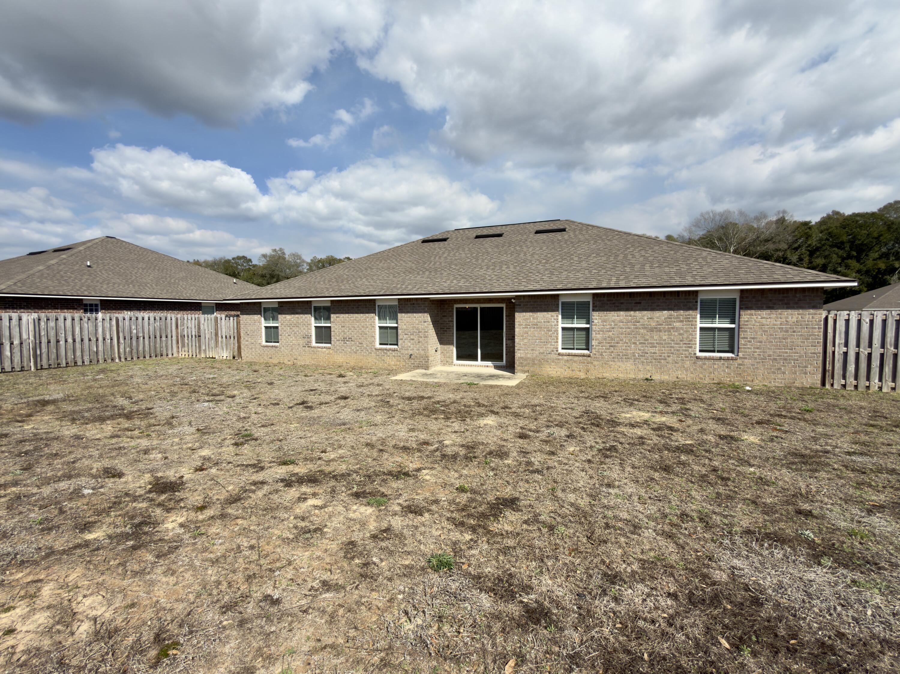 5281 Moore Loop Crestview, FL 32536 - Photo 27 of 28 a front view of a house with a yard