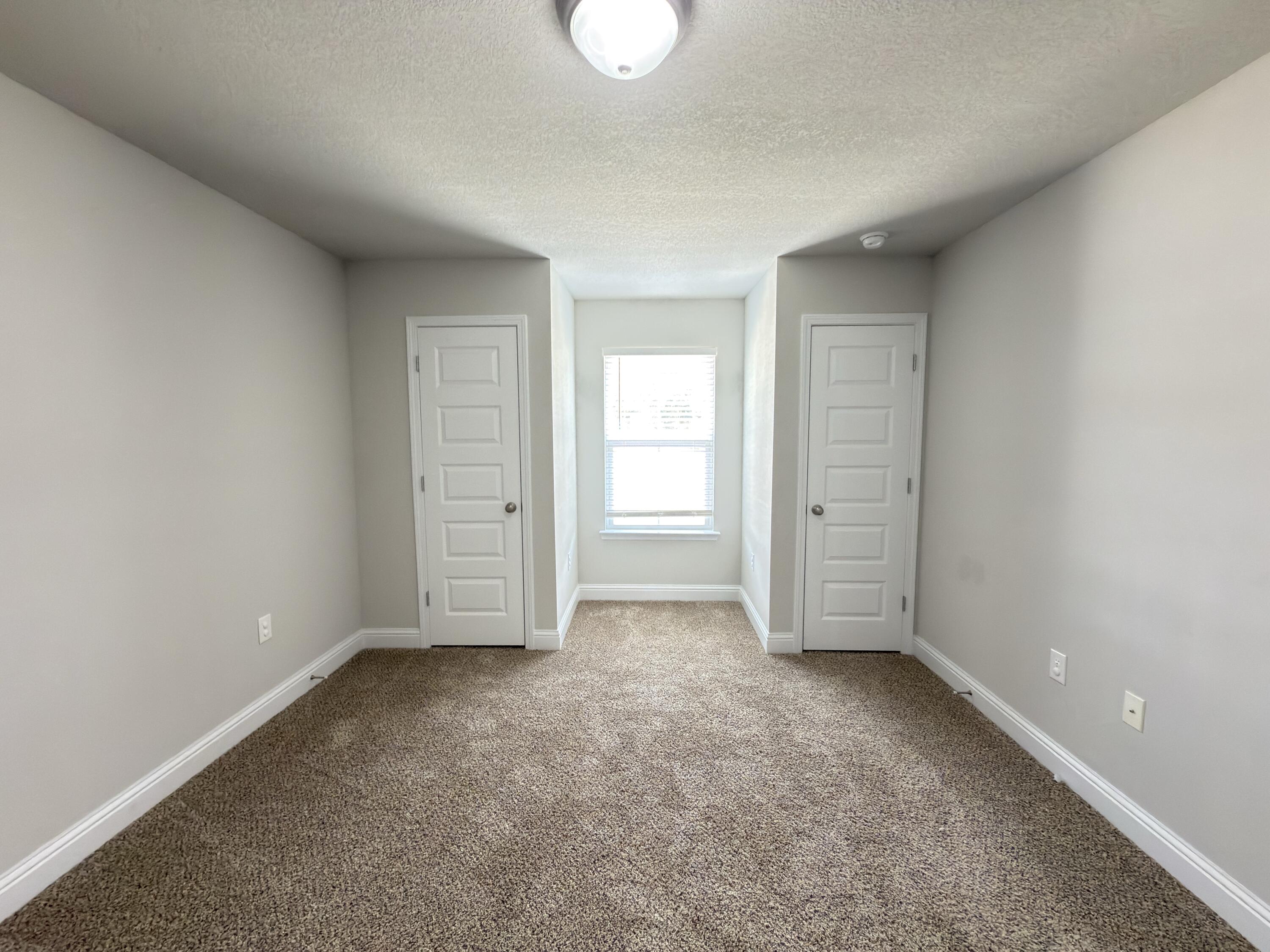 5281 Moore Loop Crestview, FL 32536 - Photo 9 of 28 an empty room with windows