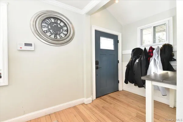 a view of a bedroom with furniture and window