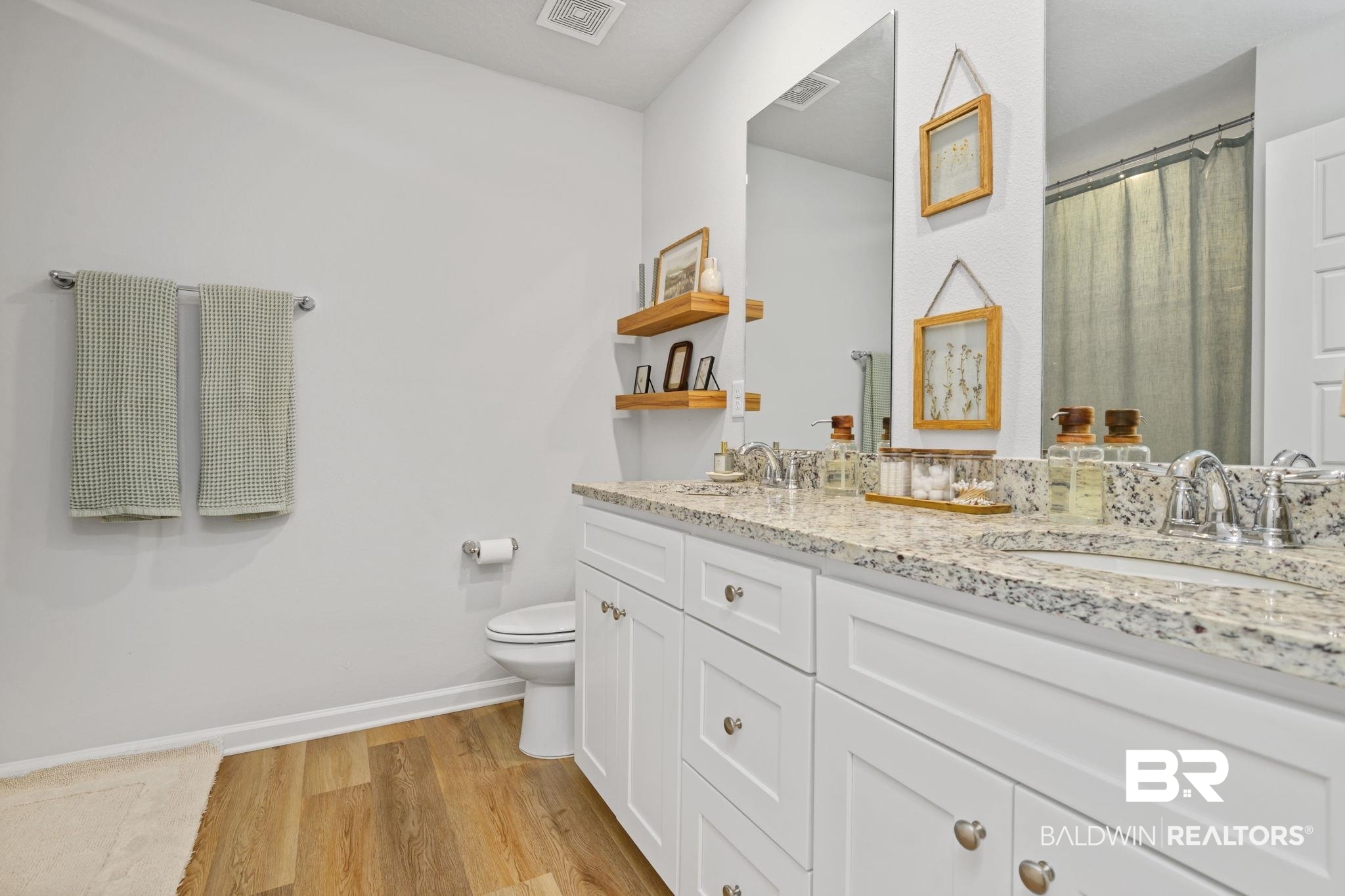 8021 Valor Rdg Way North Mobile, AL 36619 - Photo 14 of 34 Bathroom featuring a dual vanity with a speckled countertop, undermount sinks, and chrome faucets