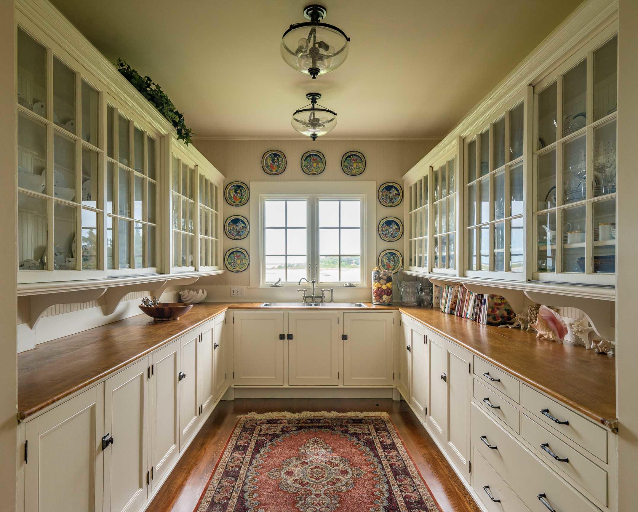 986 Sea View Avenue Osterville, MA 02655 - Photo 18 of 35 a kitchen with stainless steel appliances a sink stove and cabinets