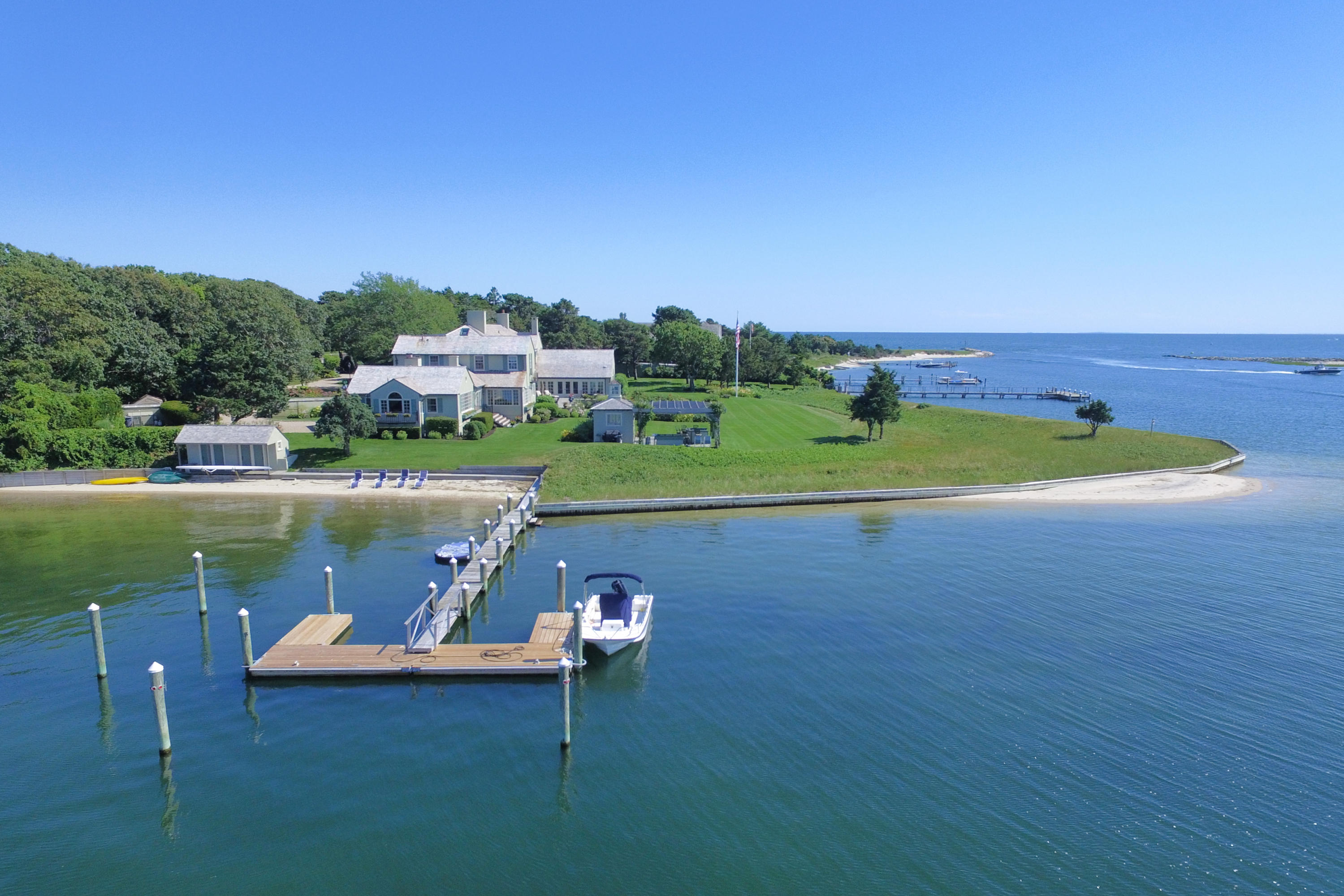 986 Sea View Avenue Osterville, MA 02655 - Photo 2 of 35 a view of a lake with a yard and large trees