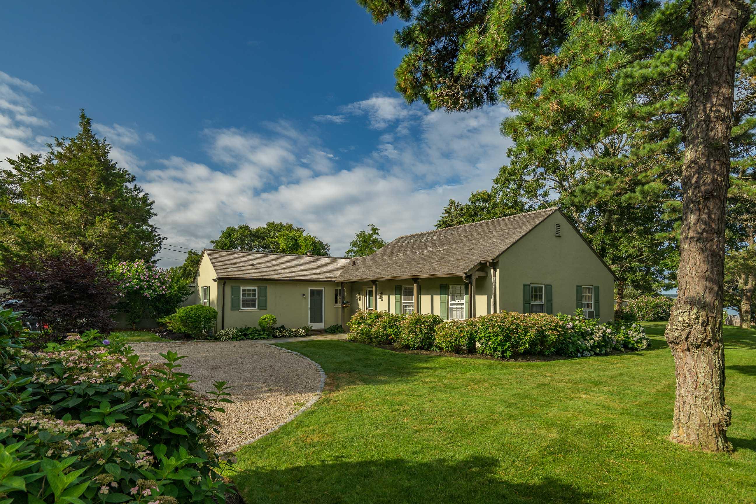 986 Sea View Avenue Osterville, MA 02655 - Photo 30 of 35 a front view of a house with a yard