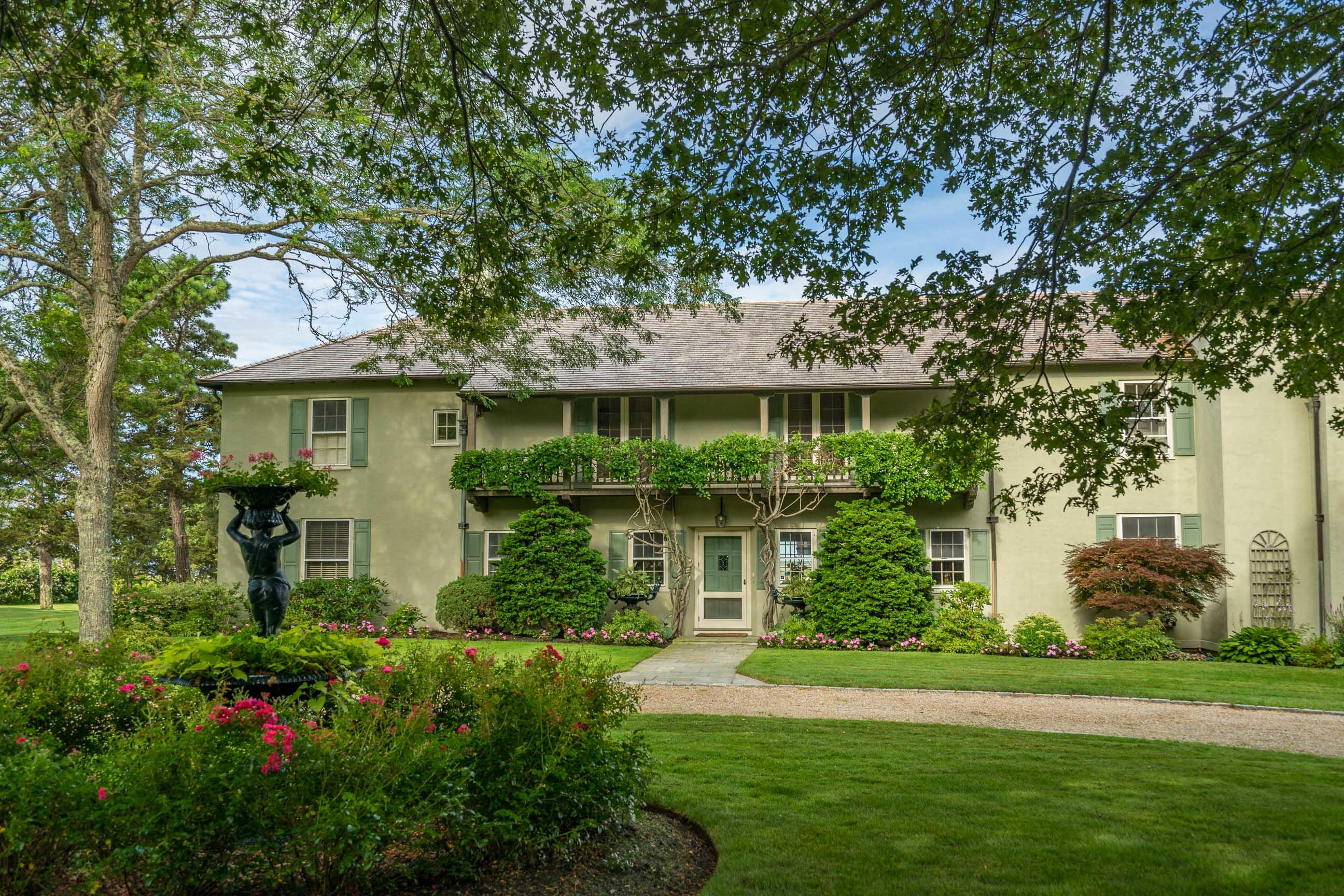 986 Sea View Avenue Osterville, MA 02655 - Photo 5 of 35 a front view of a house with a garden