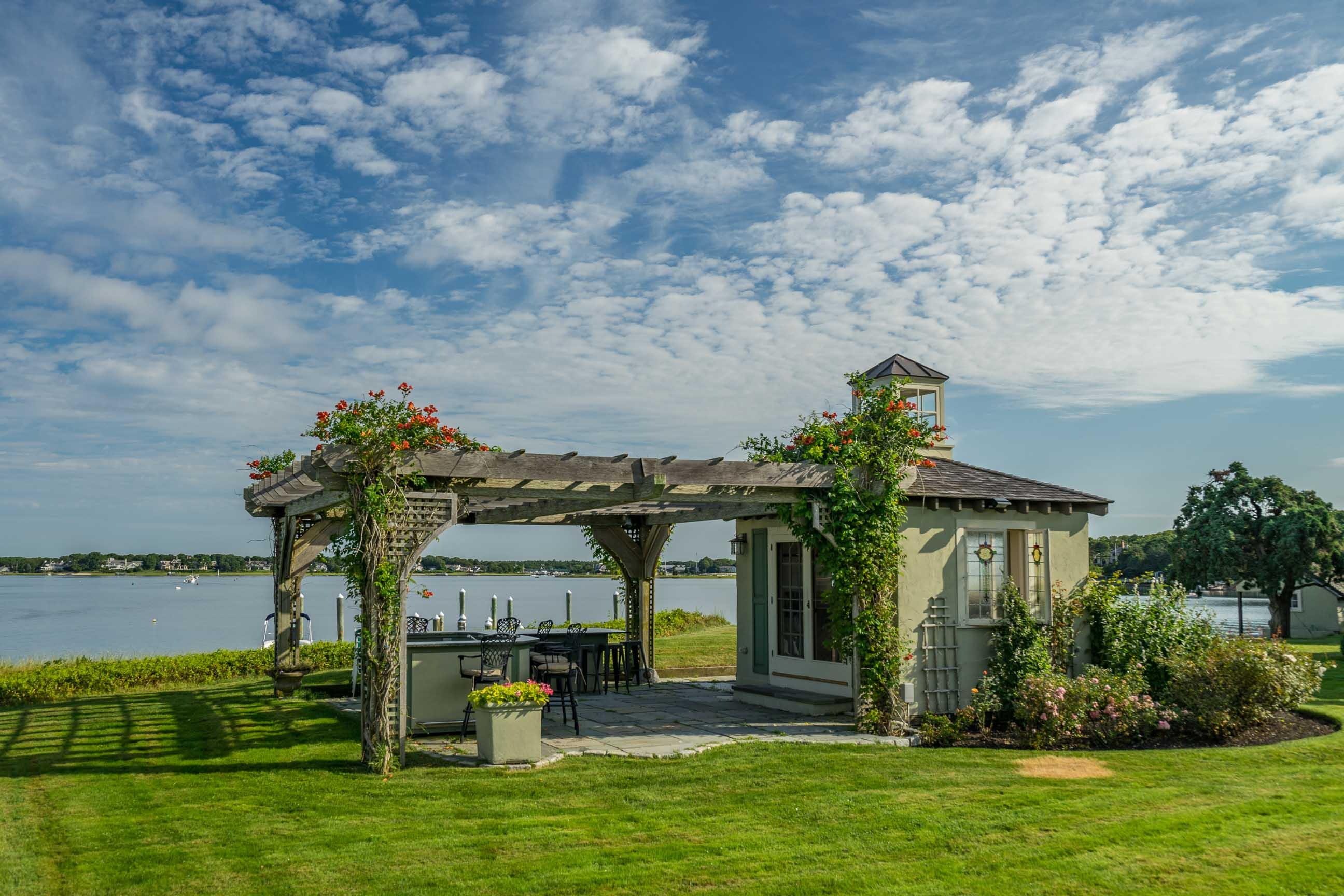 986 Sea View Avenue Osterville, MA 02655 - Photo 9 of 35 a front view of a house with garden