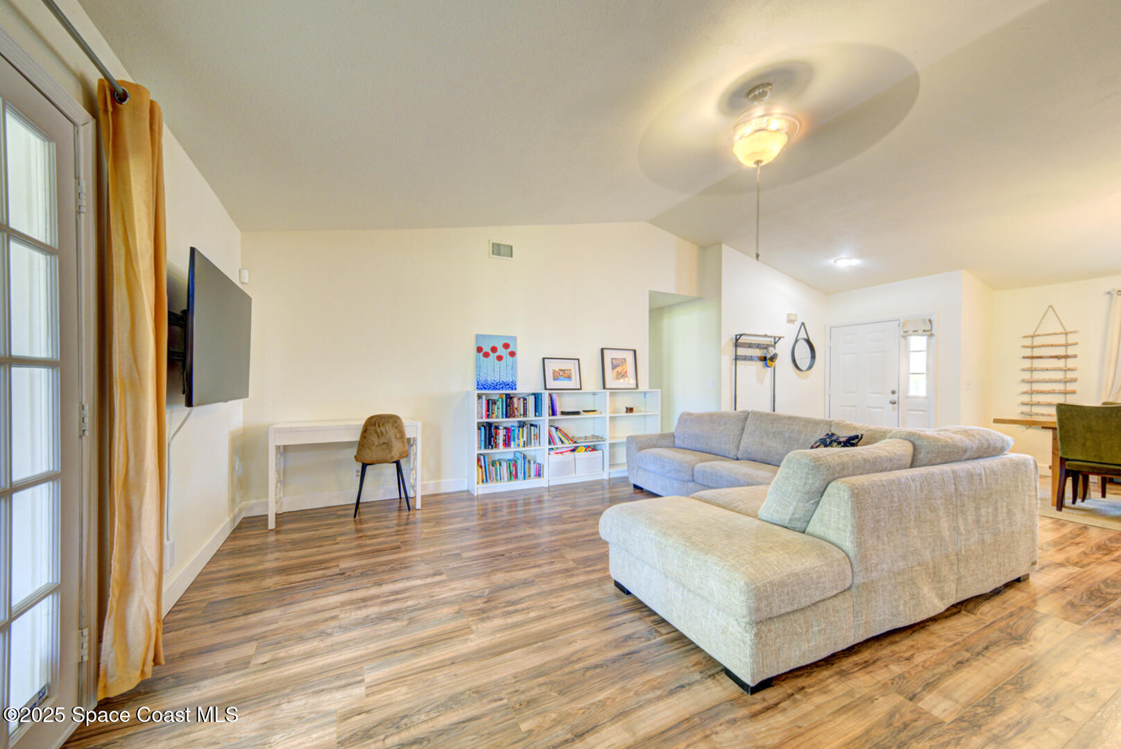 805 Gardener Road Rockledge, FL 32955 - Photo 8 of 38 living room with vaulted ceiling