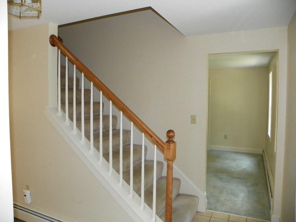 22 Durrell's Woods Road Arundel, ME 04046 - Photo 22 of 33 Front staircase with den/office beyond.