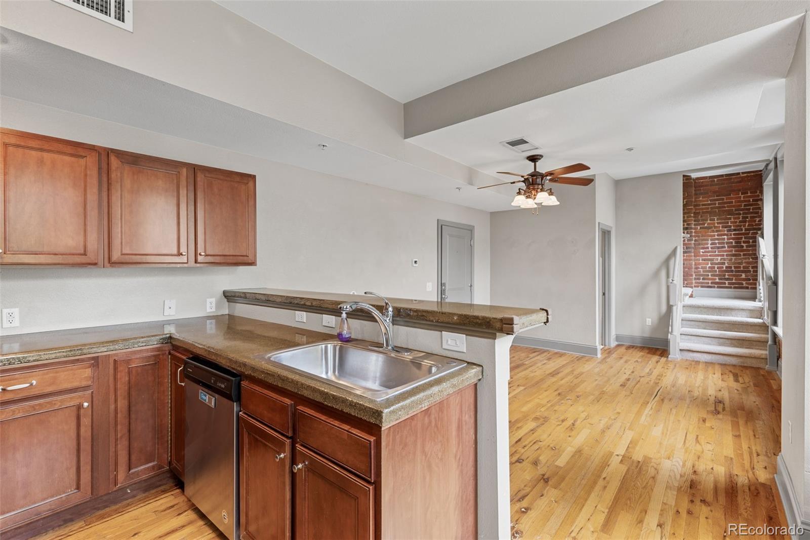 3211 Zuni Street, Unit 9 Denver, CO 80211 - Photo 15 of 36 a kitchen with a sink and cabinets