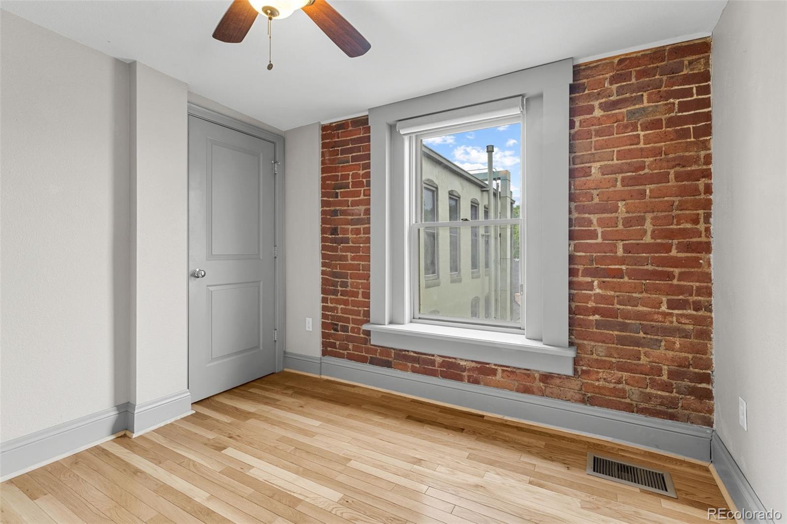 3211 Zuni Street, Unit 9 Denver, CO 80211 - Photo 26 of 36 a view of an empty room with a window