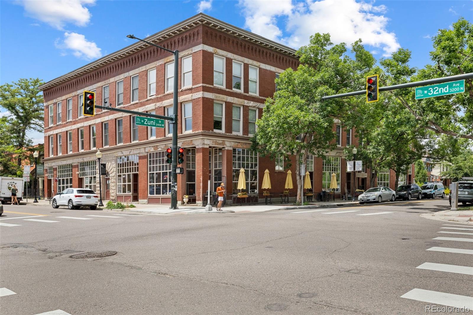 3211 Zuni Street, Unit 9 Denver, CO 80211 - Photo 3 of 36 a front view of a building and a street