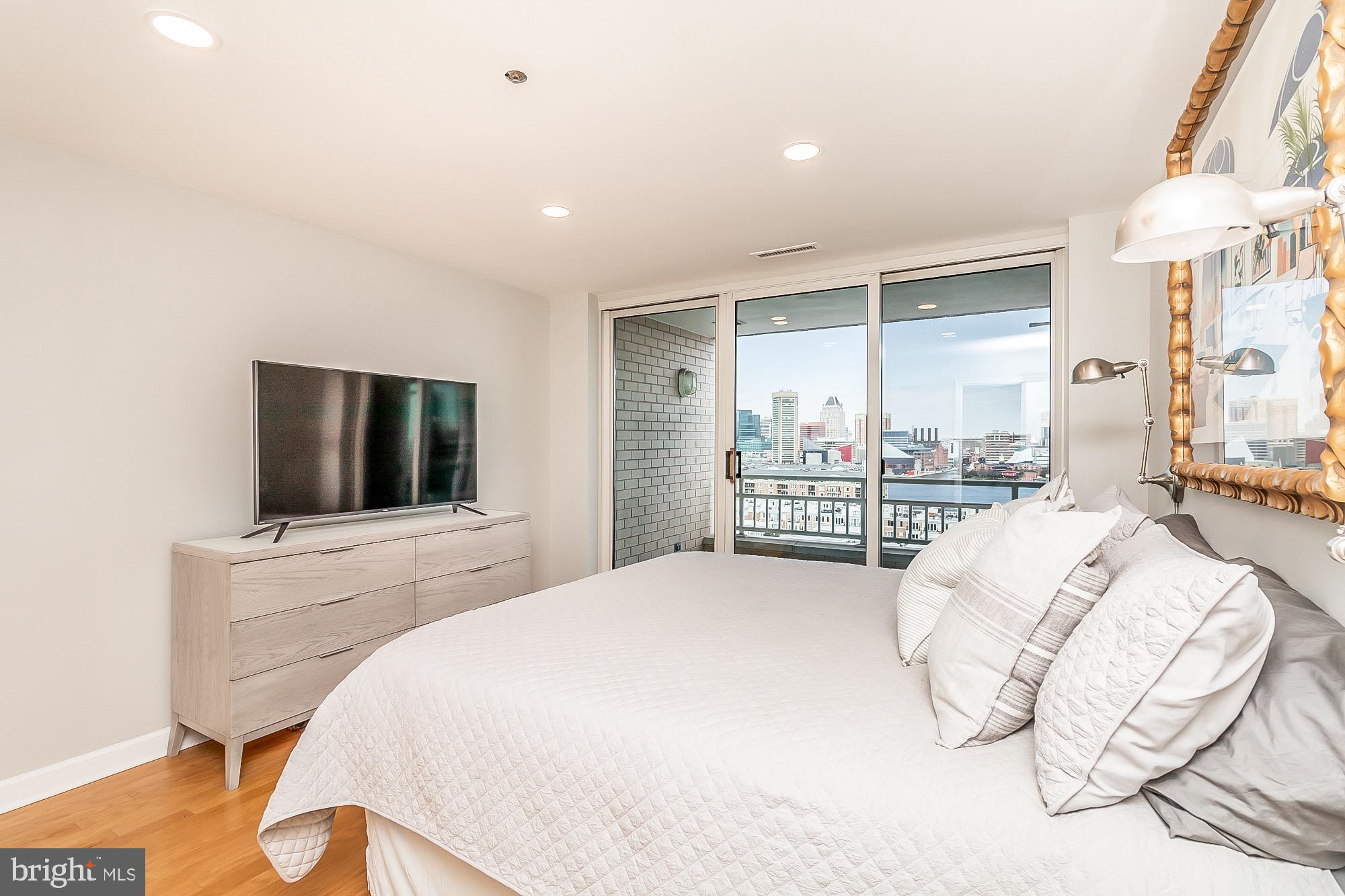 100 Harborview Drive, Unit 1001 Baltimore, MD 21230 - Photo 30 of 64 Master bedroom w/ balcony access