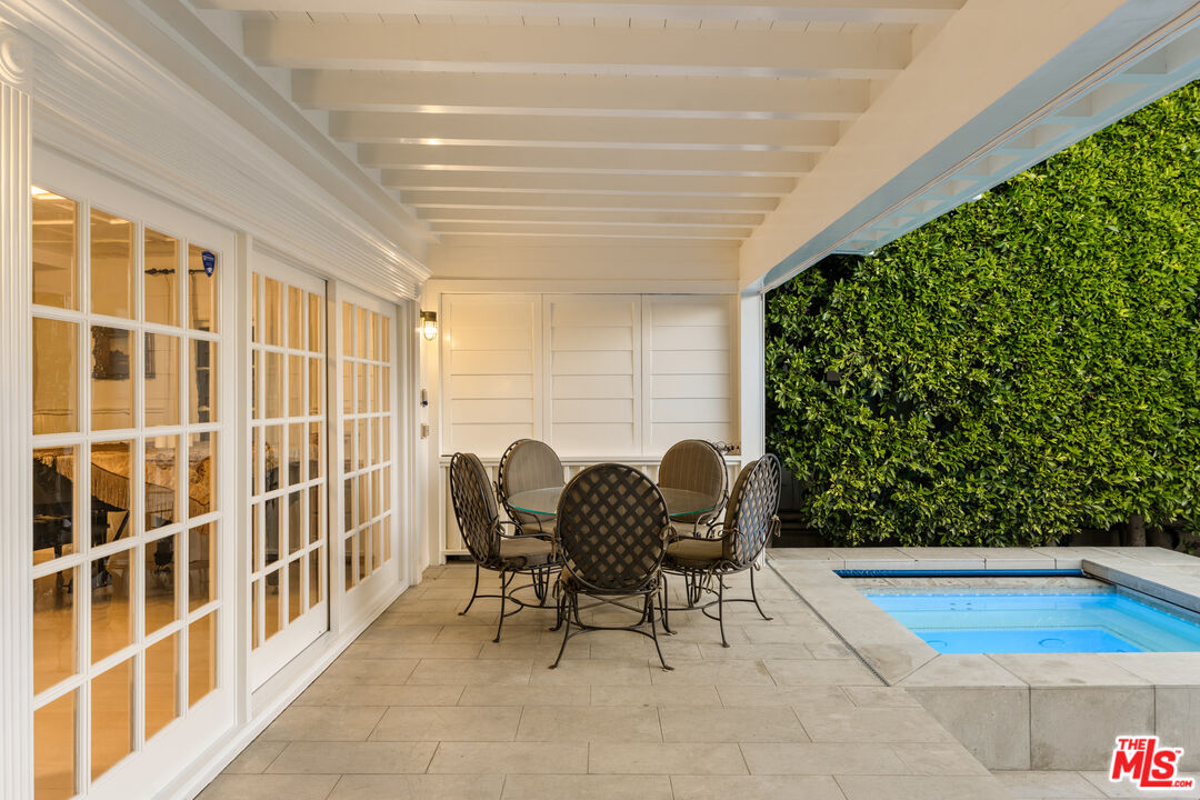 501 Palisades Beach Road Santa Monica, CA 90402 - Photo 15 of 29 a view of a chairs and table in the patio