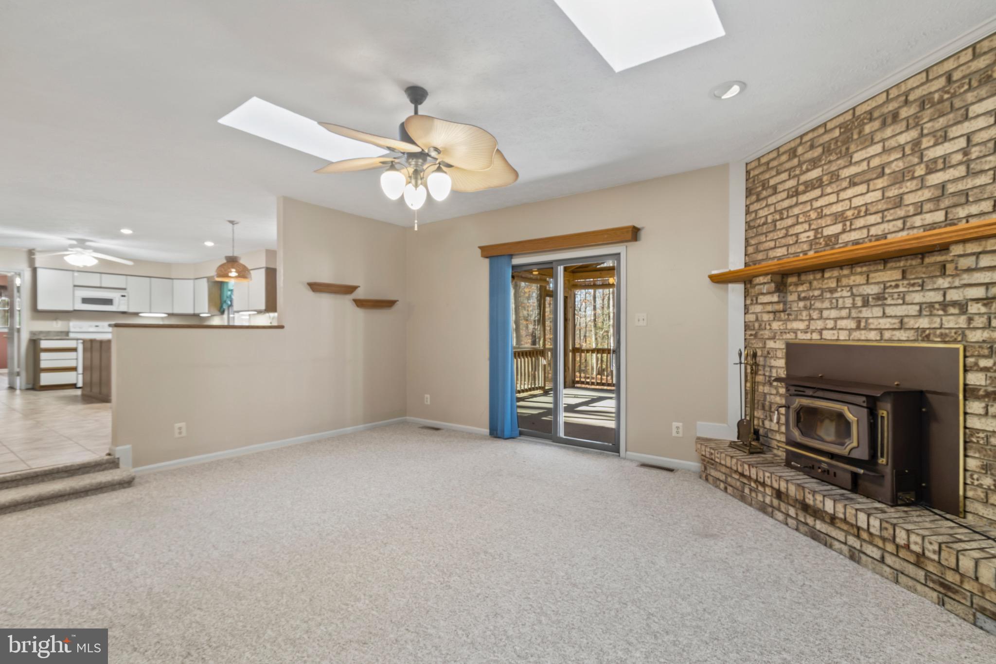 9675 Faith Baptist Church Road White Plains, MD 20695 - Photo 11 of 53 an empty room with windows and fireplace