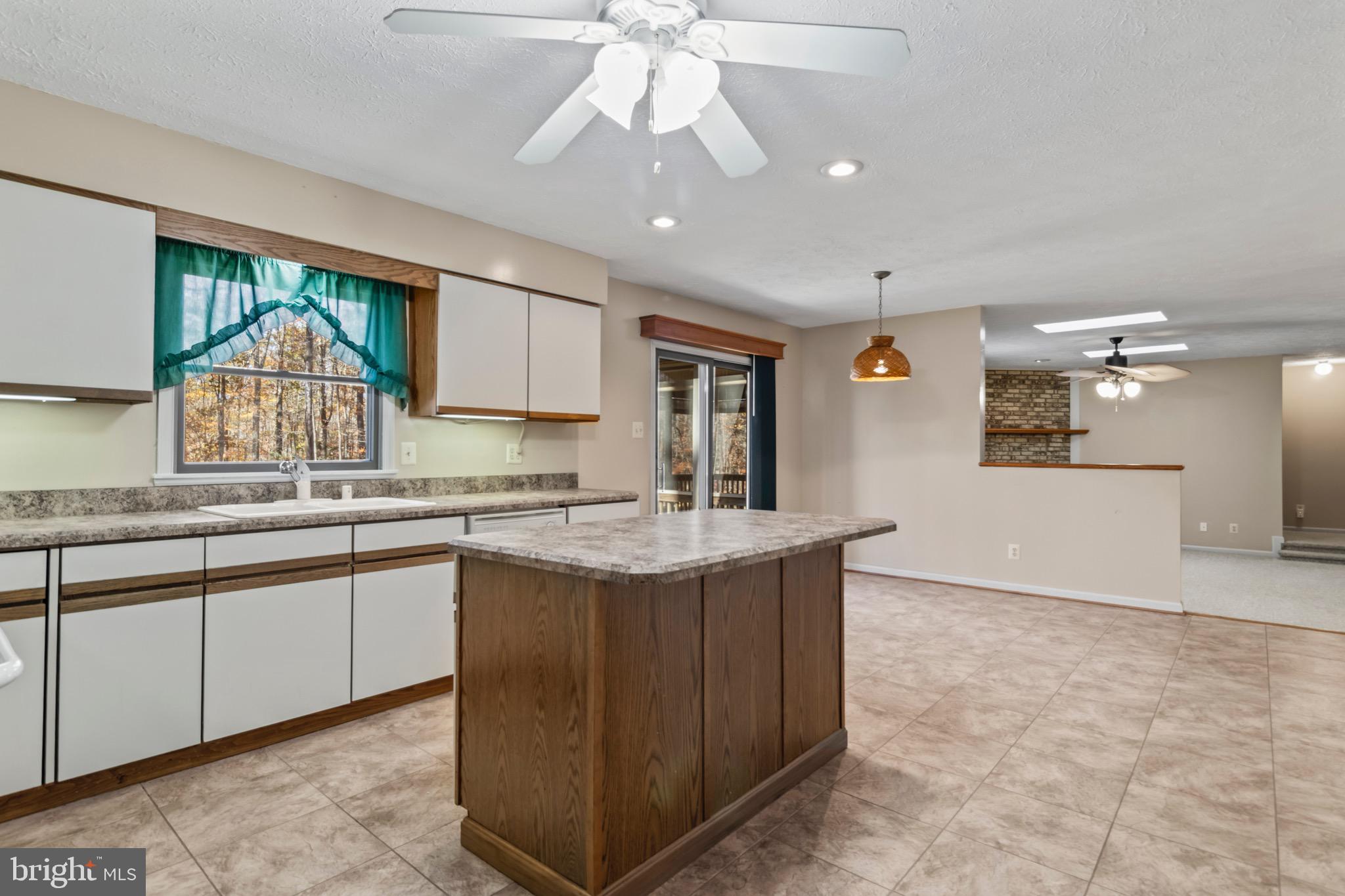 9675 Faith Baptist Church Road White Plains, MD 20695 - Photo 12 of 53 a kitchen with granite countertop a sink and a stove