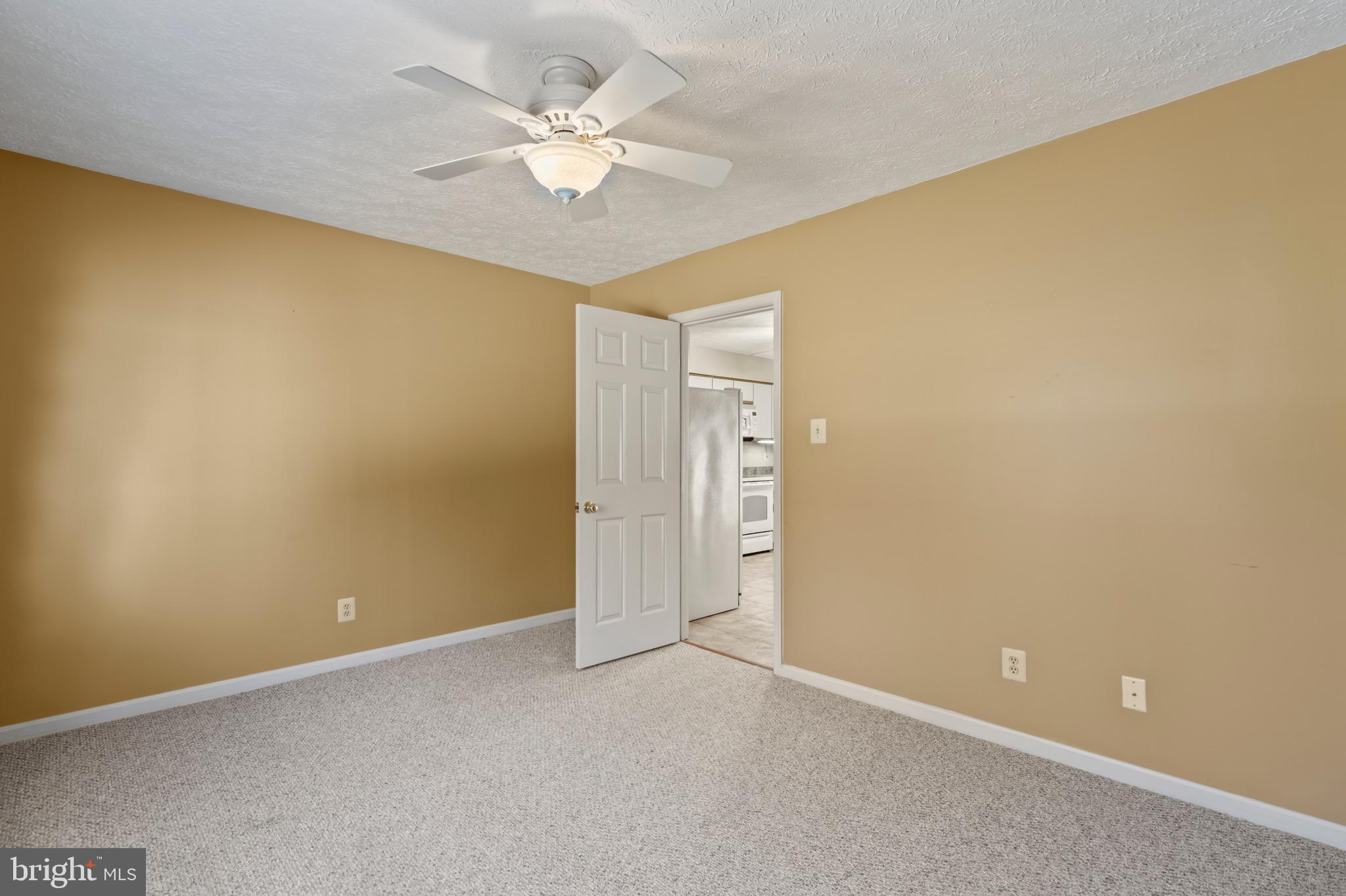 9675 Faith Baptist Church Road White Plains, MD 20695 - Photo 14 of 53 an empty room with a empty space and a ceiling fan