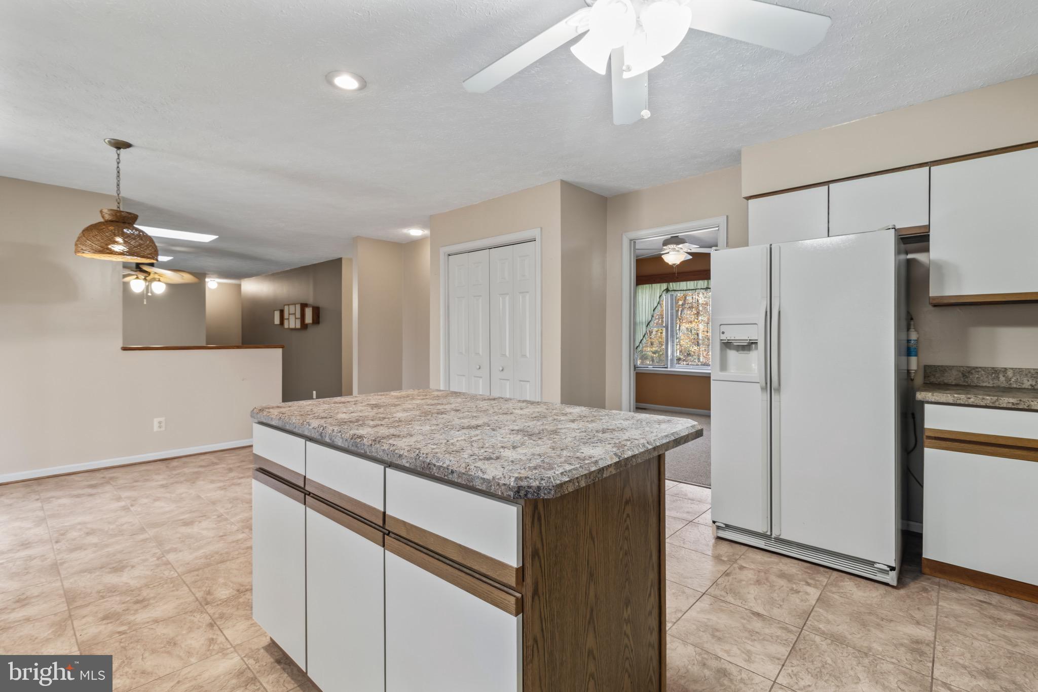 9675 Faith Baptist Church Road White Plains, MD 20695 - Photo 19 of 53 a kitchen with stainless steel appliances granite countertop cabinets a refrigerator and a sink