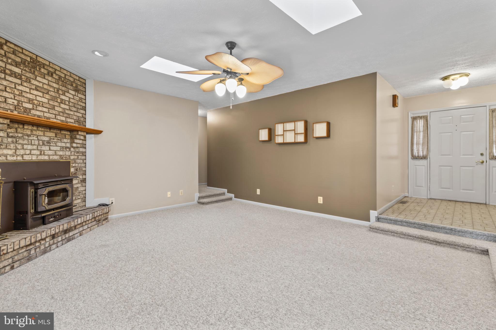 9675 Faith Baptist Church Road White Plains, MD 20695 - Photo 22 of 53 a view of an empty room with a fireplace
