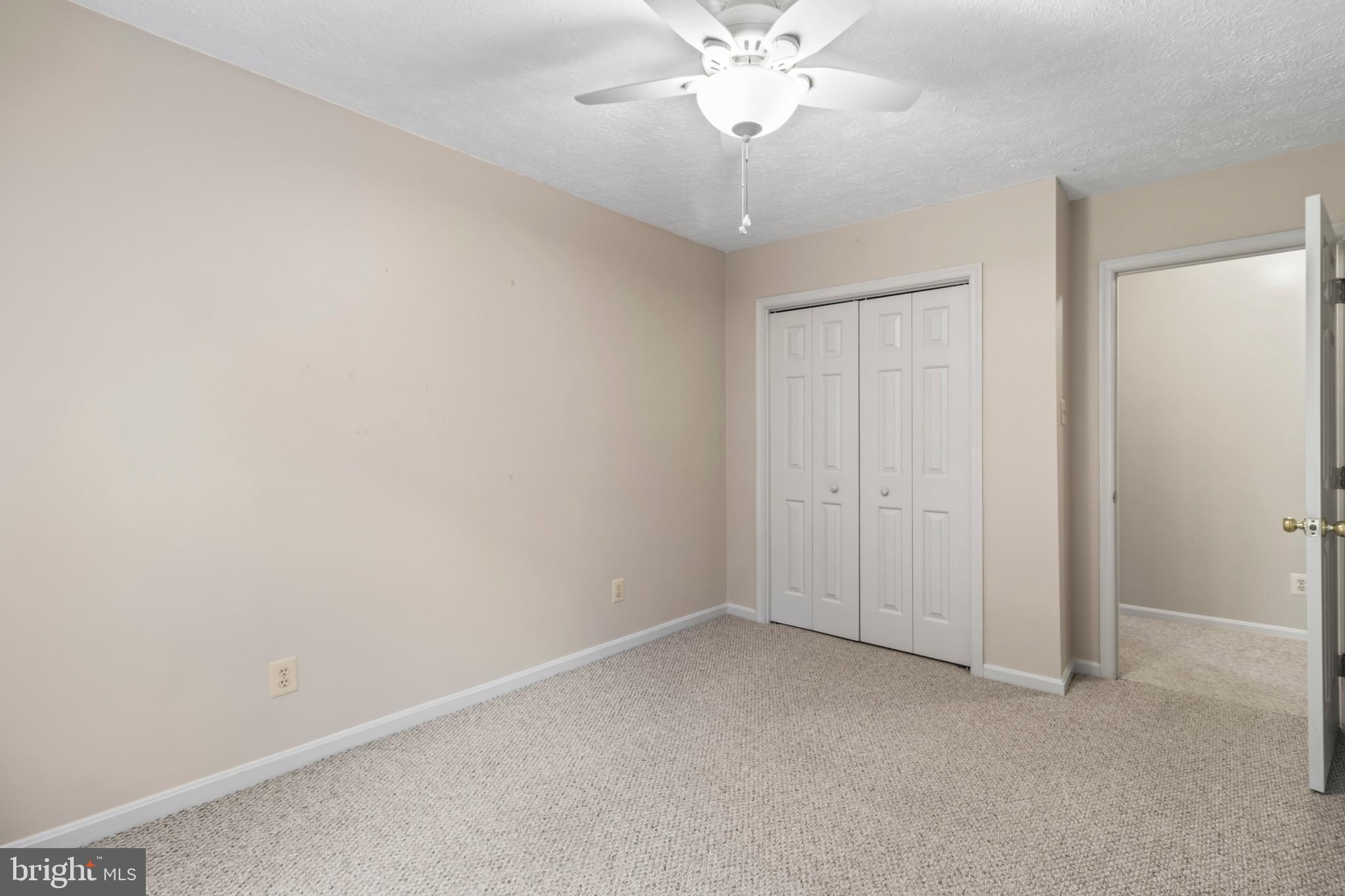 9675 Faith Baptist Church Road White Plains, MD 20695 - Photo 25 of 53 an empty room with a chandelier fan