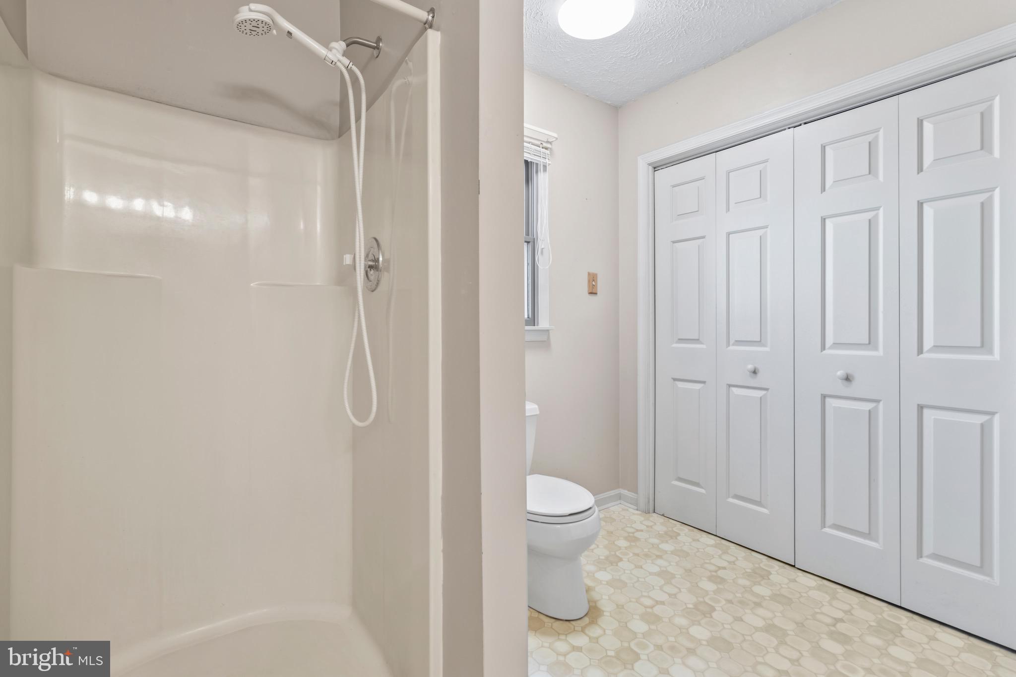 9675 Faith Baptist Church Road White Plains, MD 20695 - Photo 29 of 53 a bathroom with a toilet a sink and shower