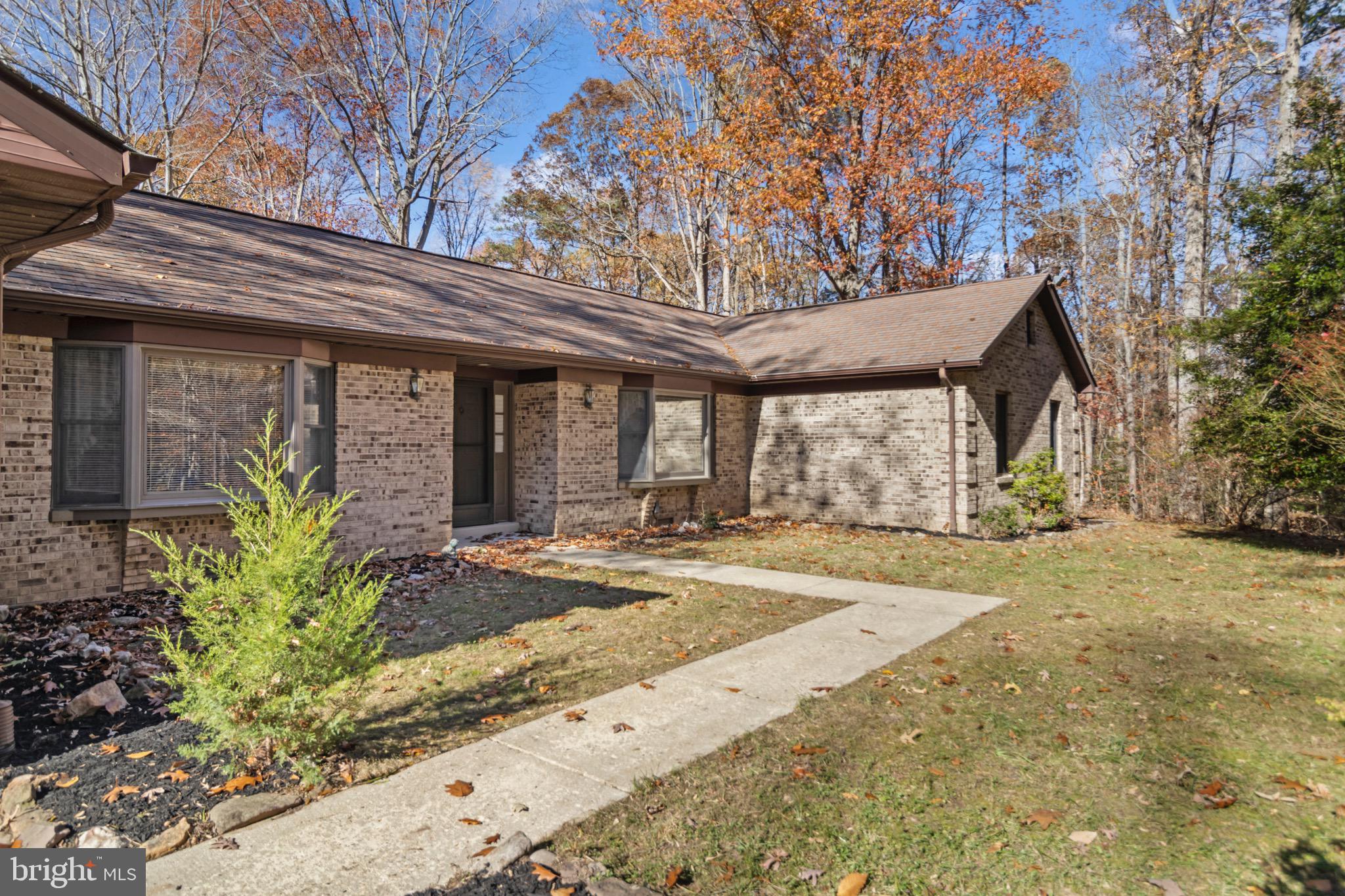 9675 Faith Baptist Church Road White Plains, MD 20695 - Photo 35 of 53 a front view of a house with garden