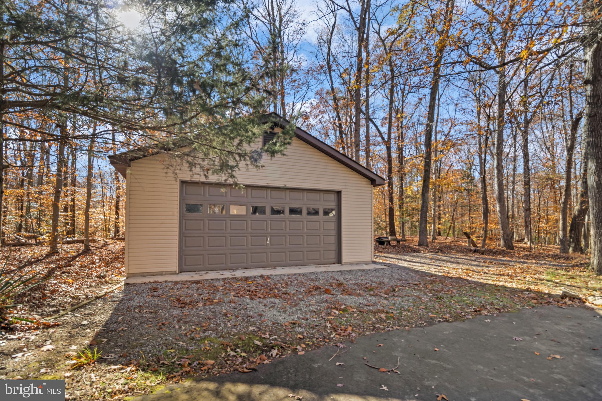 9675 Faith Baptist Church Road White Plains, MD 20695 - Photo 37 of 53 a front view of a house with a yard and garage