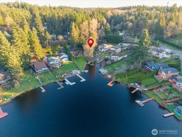 an aerial view of a house with a yard and garden