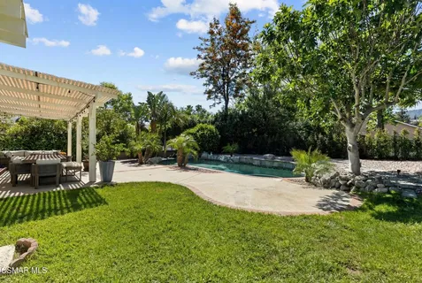 a view of a backyard with a patio