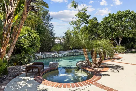 a view of a swimming pool with a patio