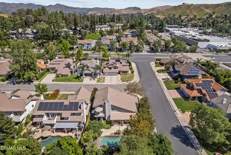 an aerial view of residential houses with outdoor space