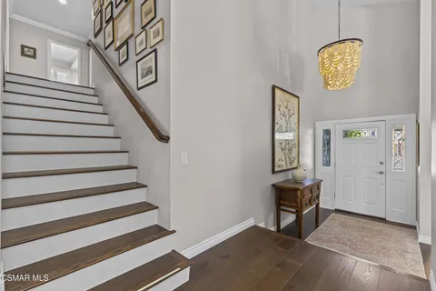 a view of entryway with stairs and furniture