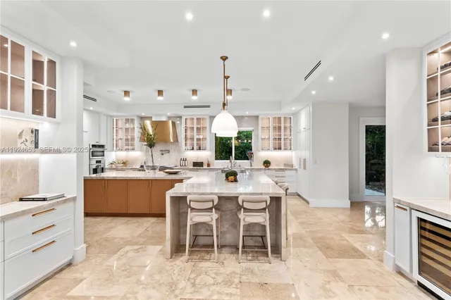 a front view of multi story residential apartment building with yard and green space