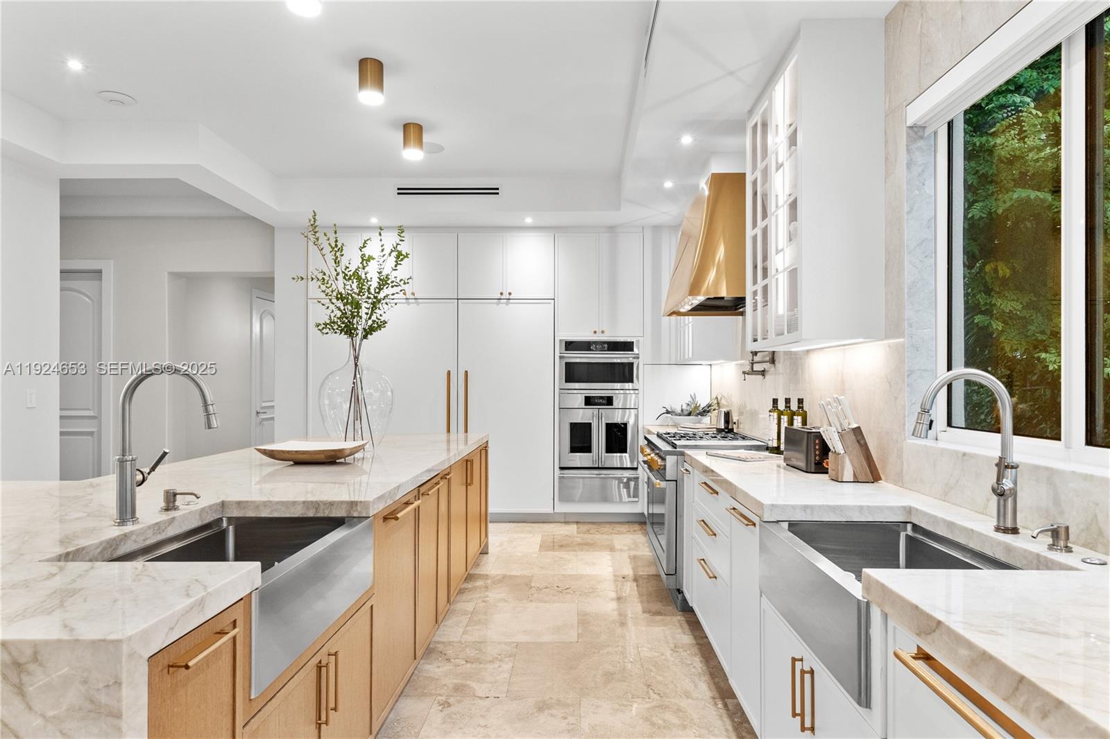 6080 Southwest 104th Street Pinecrest, FL 33156 - Photo 17 of 75 a large kitchen with stainless steel appliances granite countertop a sink stove and cabinets