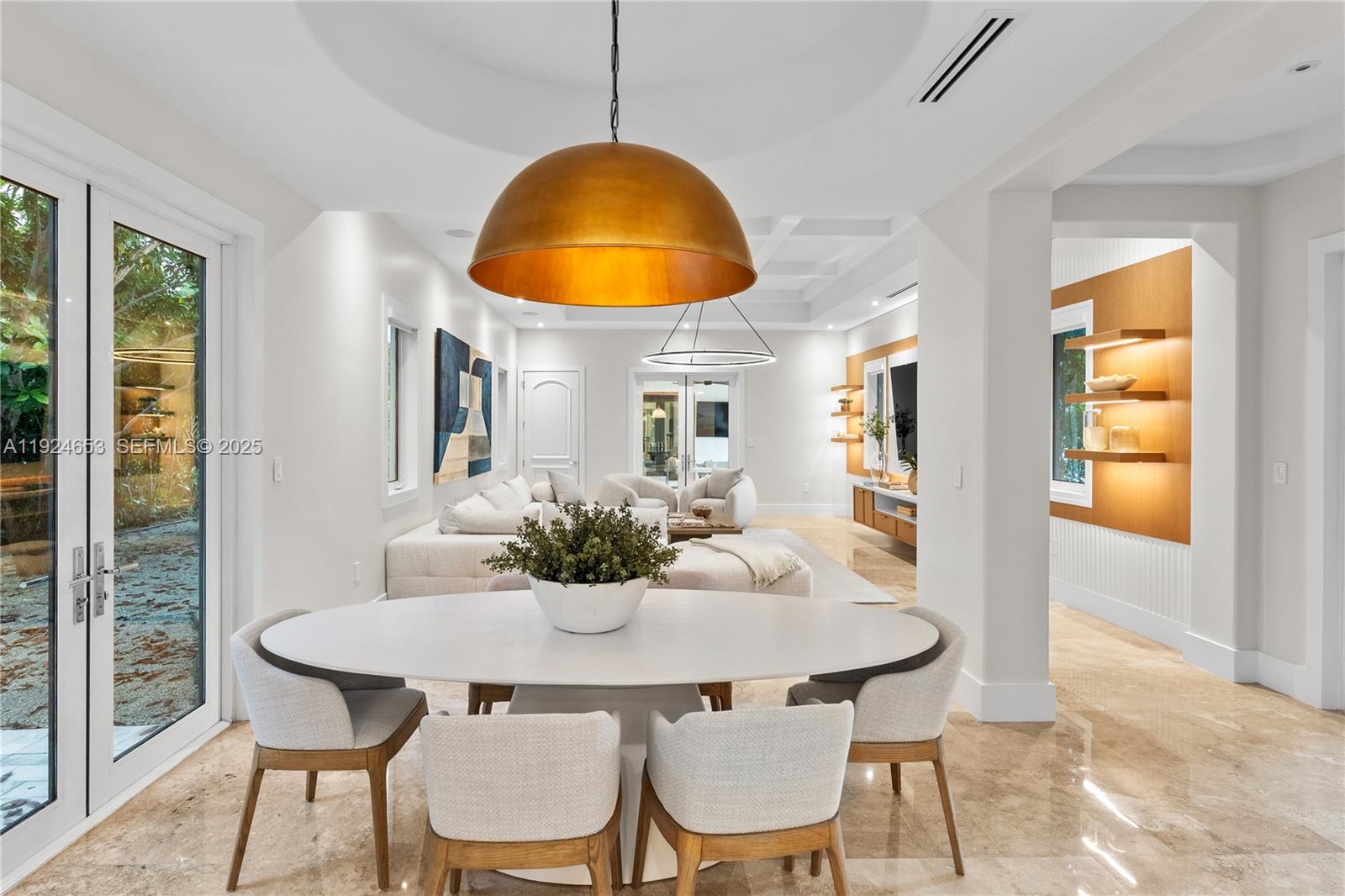 6080 Southwest 104th Street Pinecrest, FL 33156 - Photo 19 of 75 a view of a dining room with furniture and wooden floor