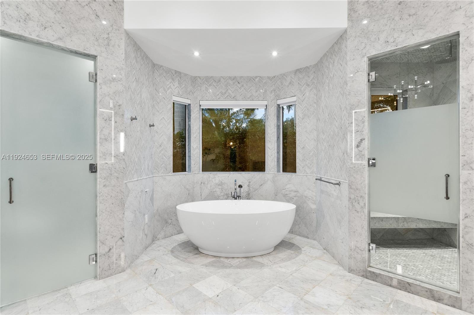 6080 Southwest 104th Street Pinecrest, FL 33156 - Photo 29 of 75 a spacious bathroom with a bathtub and shower