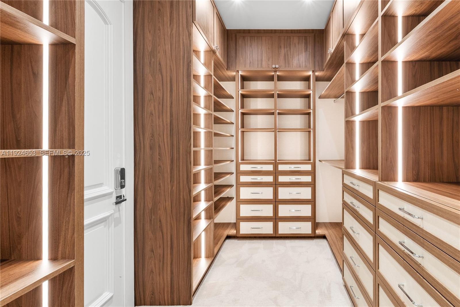 6080 Southwest 104th Street Pinecrest, FL 33156 - Photo 34 of 75 a view of walk in closet with empty racks