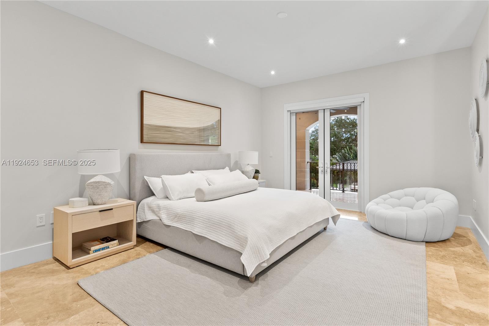 6080 Southwest 104th Street Pinecrest, FL 33156 - Photo 51 of 75 a bedroom with a bed and large window