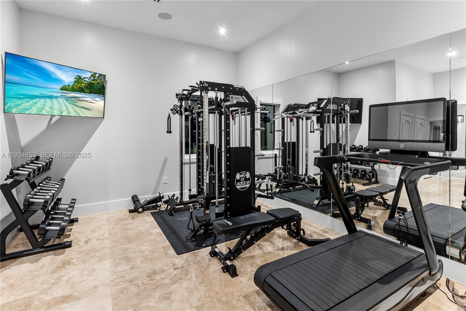 6080 Southwest 104th Street Pinecrest, FL 33156 - Photo 57 of 75 a view of a room with gym equipment