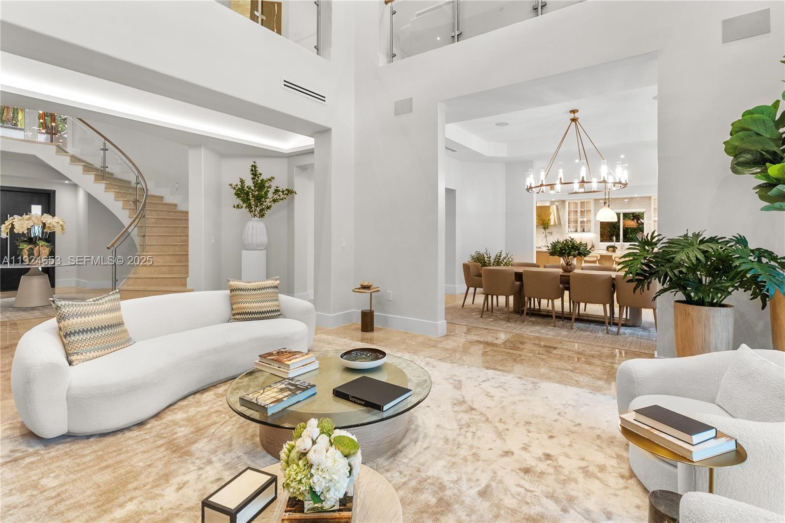 6080 Southwest 104th Street Pinecrest, FL 33156 - Photo 6 of 75 a living room with furniture a chandelier and a chandelier