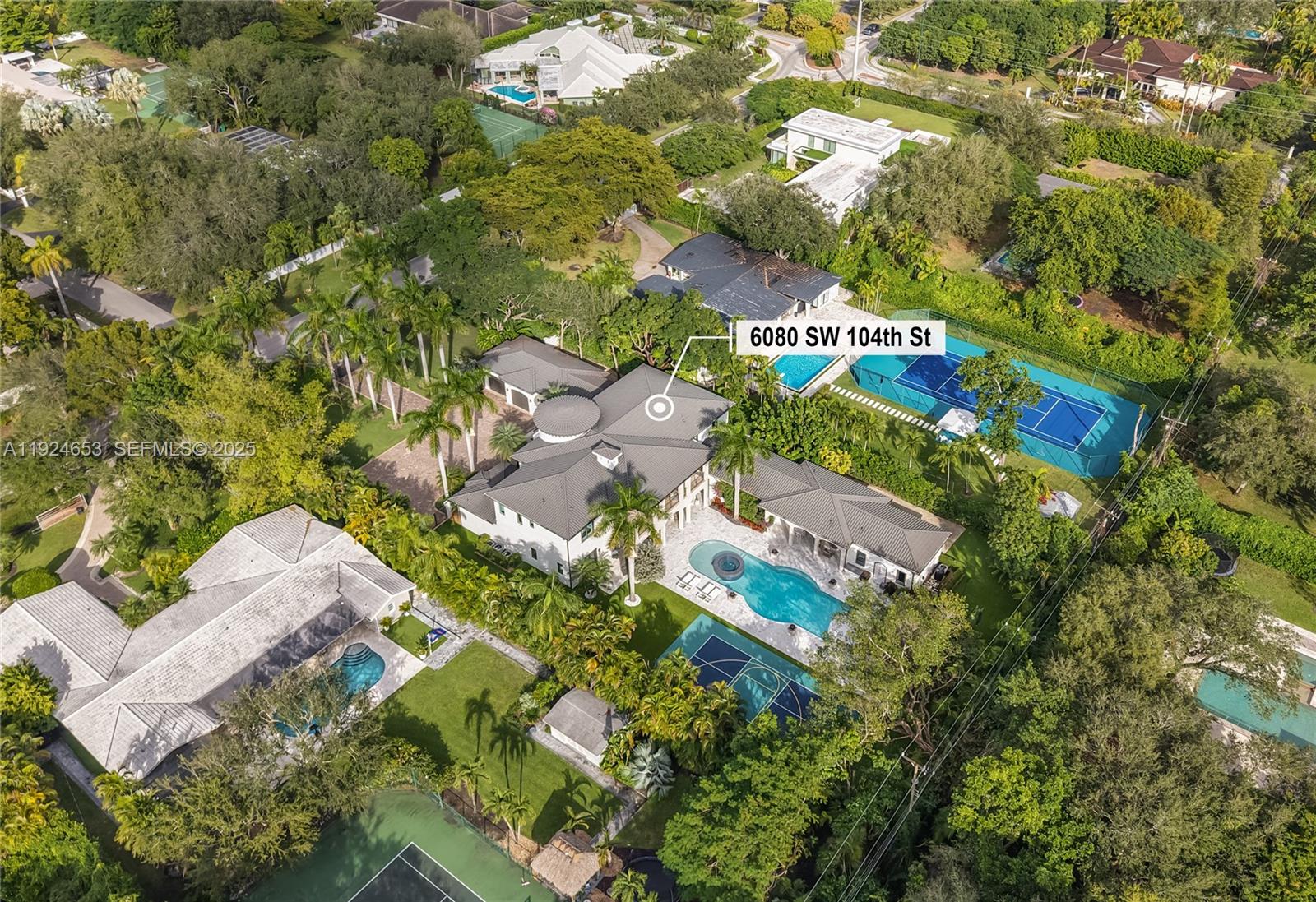 6080 Southwest 104th Street Pinecrest, FL 33156 - Photo 68 of 75 an aerial view of residential house with outdoor space and trees all around