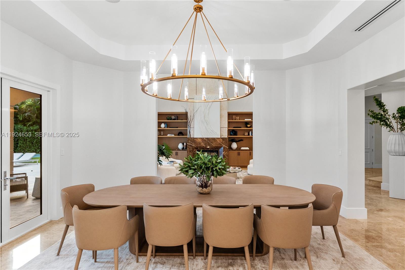 6080 Southwest 104th Street Pinecrest, FL 33156 - Photo 7 of 75 a view of a dining room with furniture window and wooden floor