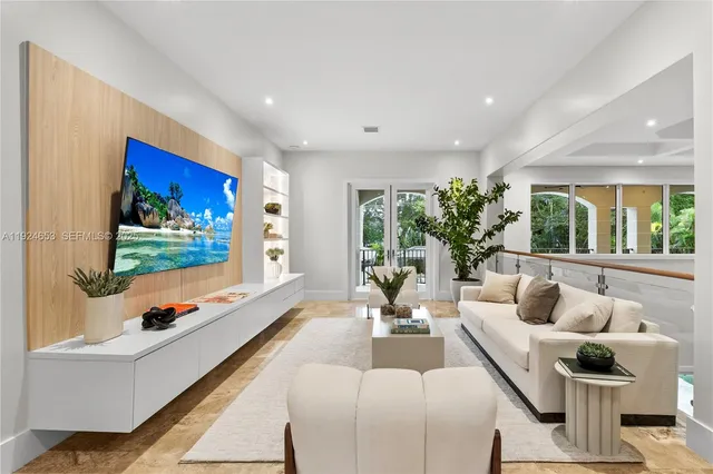 a bedroom with a bed and large window