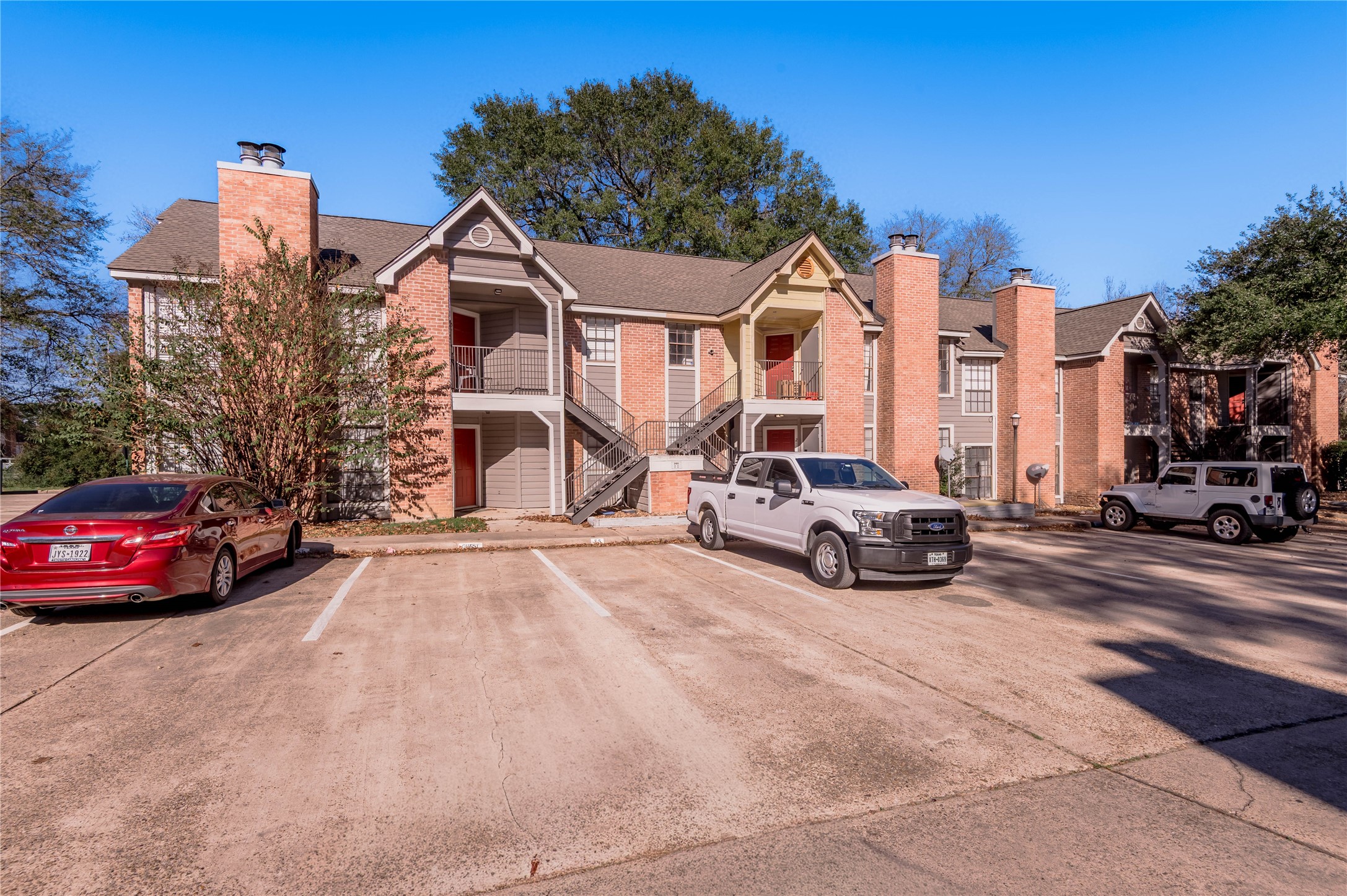 2401 Sycamore Avenue, Unit E2 Huntsville, TX 77340 - Photo 19 of 19 a view of a street with cars