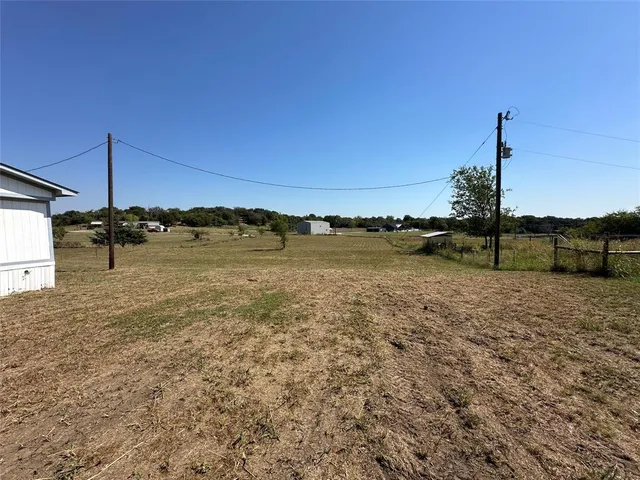 a view of a lake with a big yard