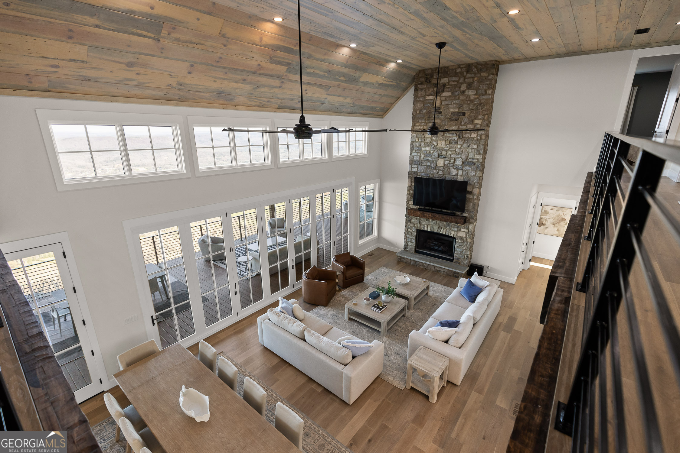 6565 Scenic Highway Rising Fawn, GA 30738 - Photo 17 of 47 a living room with furniture a fireplace and a flat screen tv
