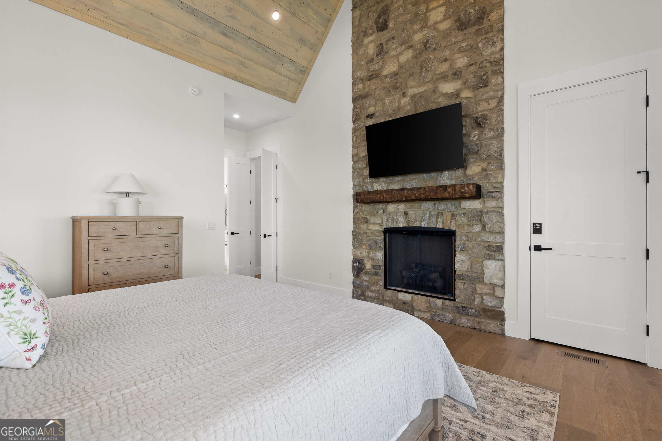 6565 Scenic Highway Rising Fawn, GA 30738 - Photo 26 of 47 a bedroom with a bed and a flat screen tv