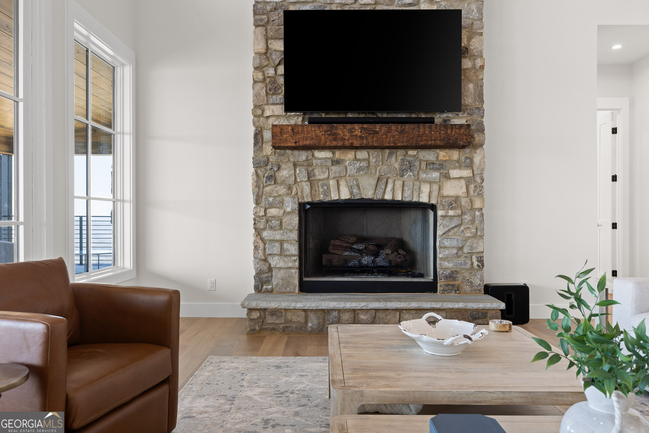 6565 Scenic Highway Rising Fawn, GA 30738 - Photo 5 of 47 a living room with furniture a flat screen tv and a fireplace