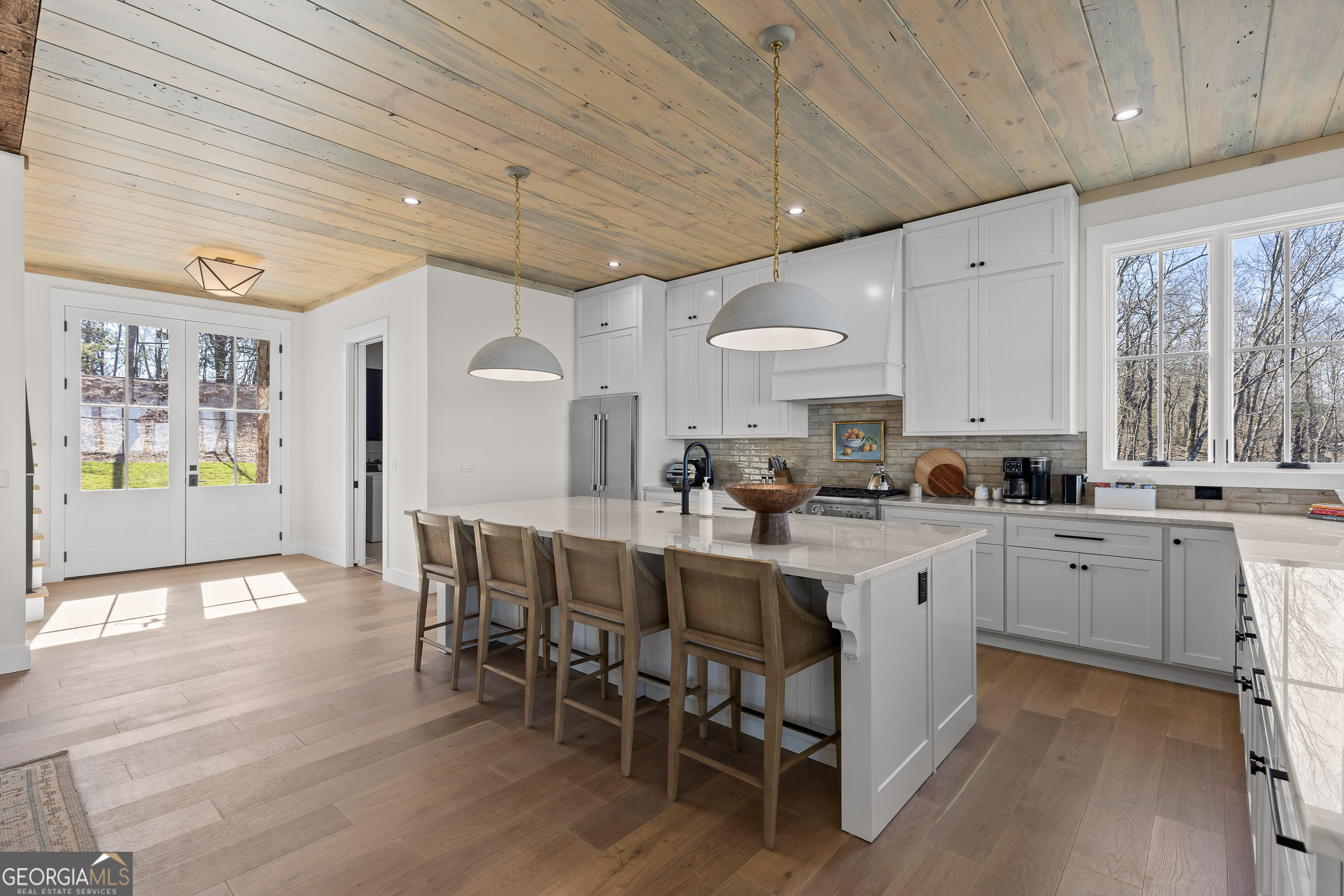 6565 Scenic Highway Rising Fawn, GA 30738 - Photo 6 of 47 a kitchen with cabinets a sink appliances and a dining table