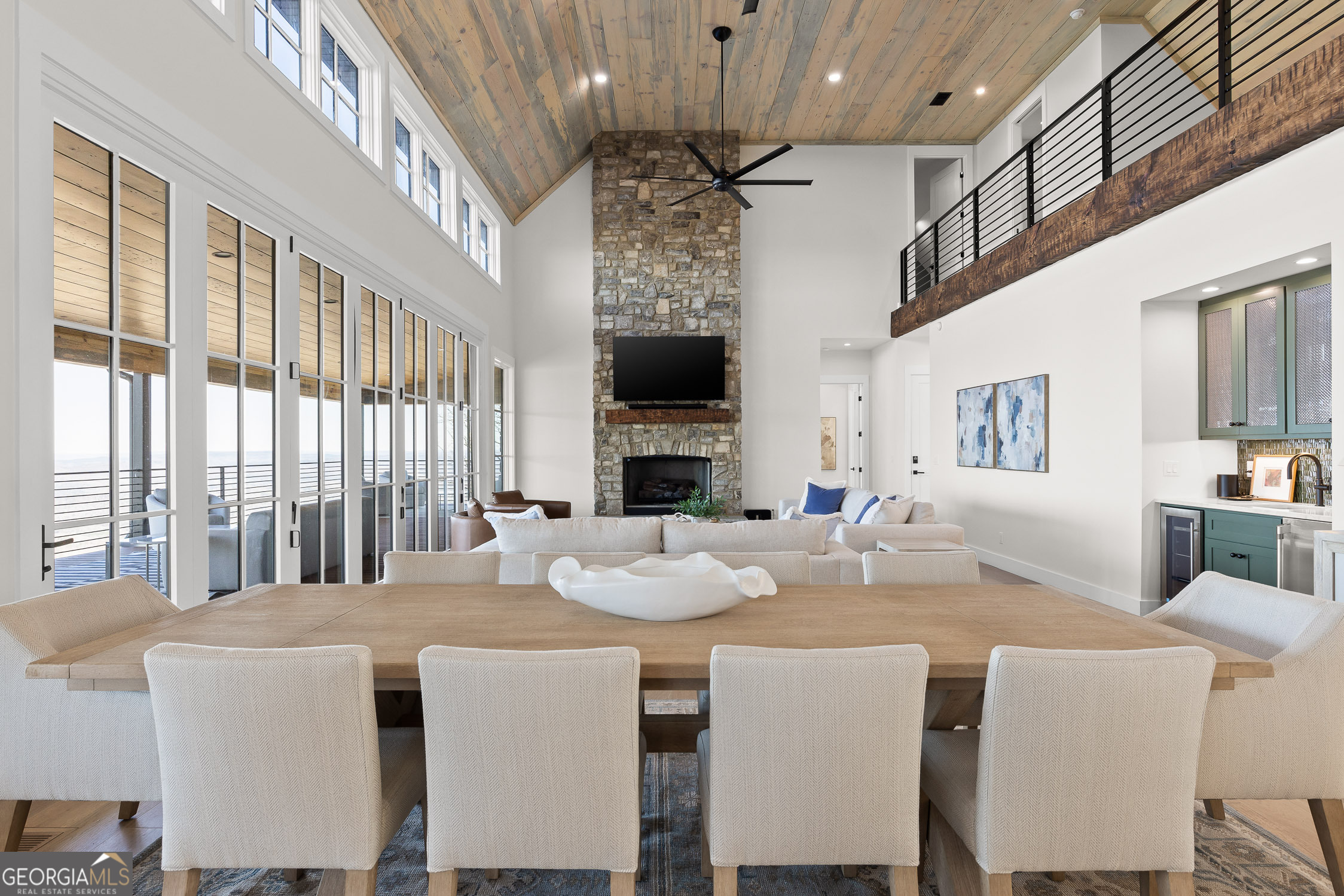 6565 Scenic Highway Rising Fawn, GA 30738 - Photo 8 of 47 a dining room with furniture a large window and a fireplace