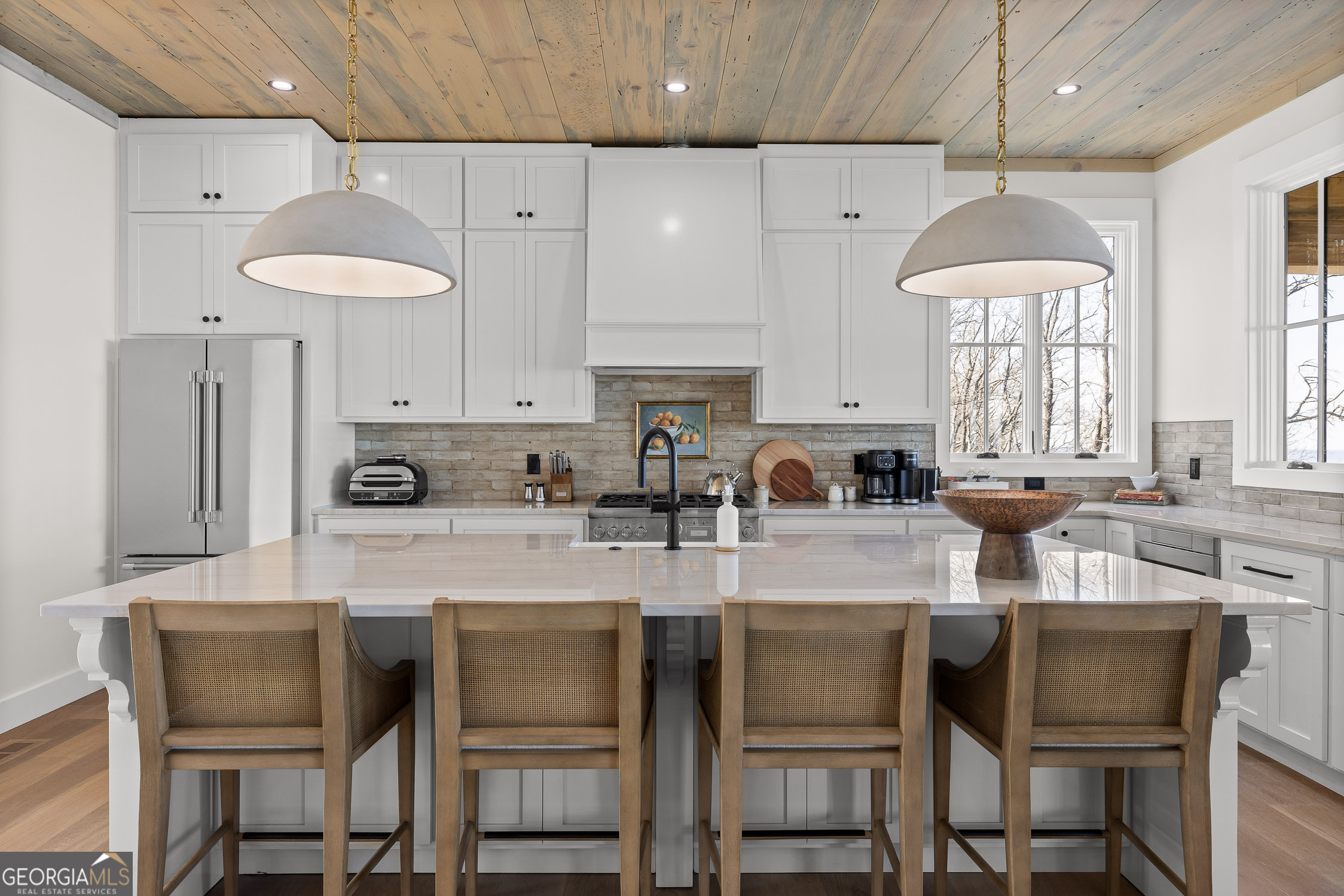 6565 Scenic Highway Rising Fawn, GA 30738 - Photo 10 of 47 a kitchen with stainless steel appliances granite countertop a table chairs refrigerator and sink